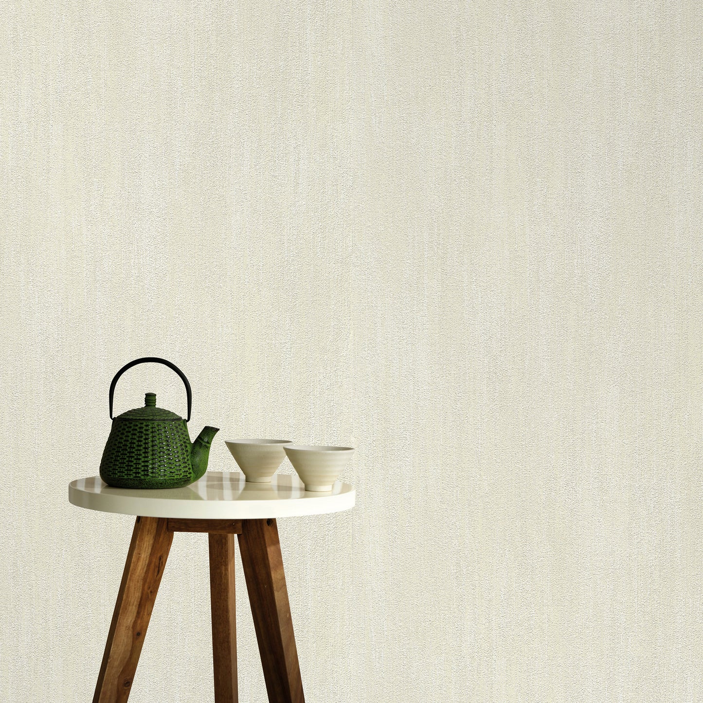 Cream wallpaper with raised texture and a traditional pattern.