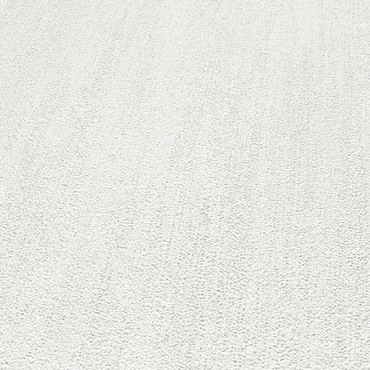 Close-up of light gray wallpaper with a raised texture and traditional pattern.