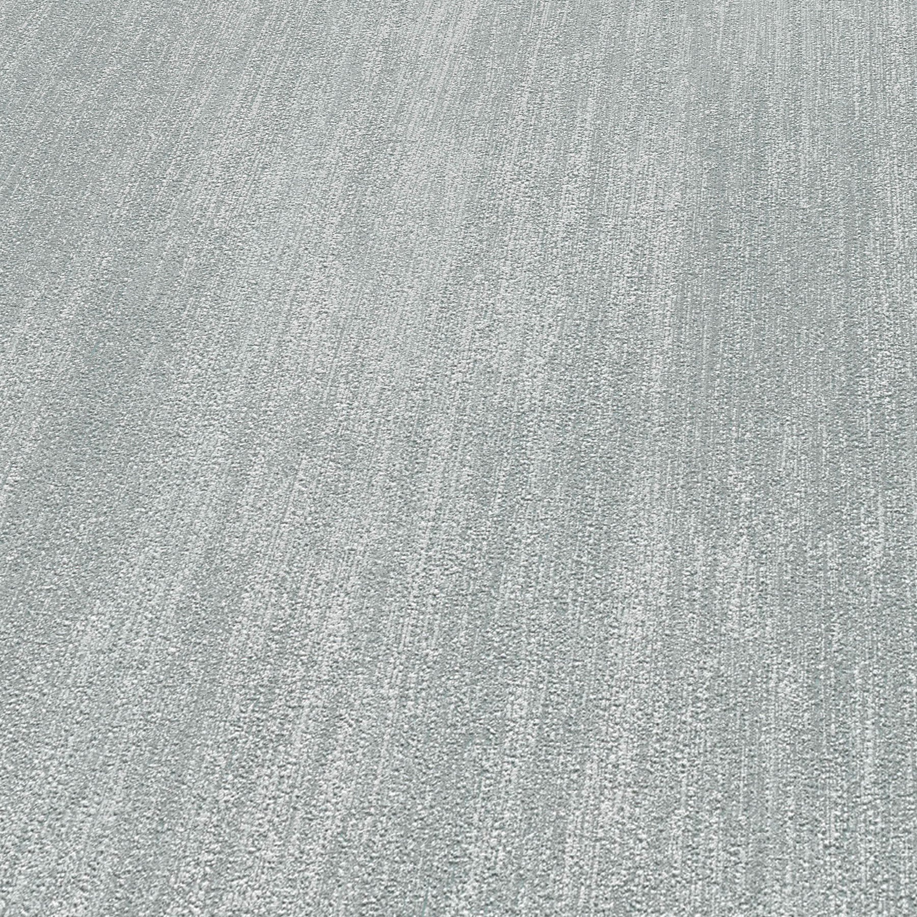 Dark gray wallpaper with raised texture and traditional pattern.