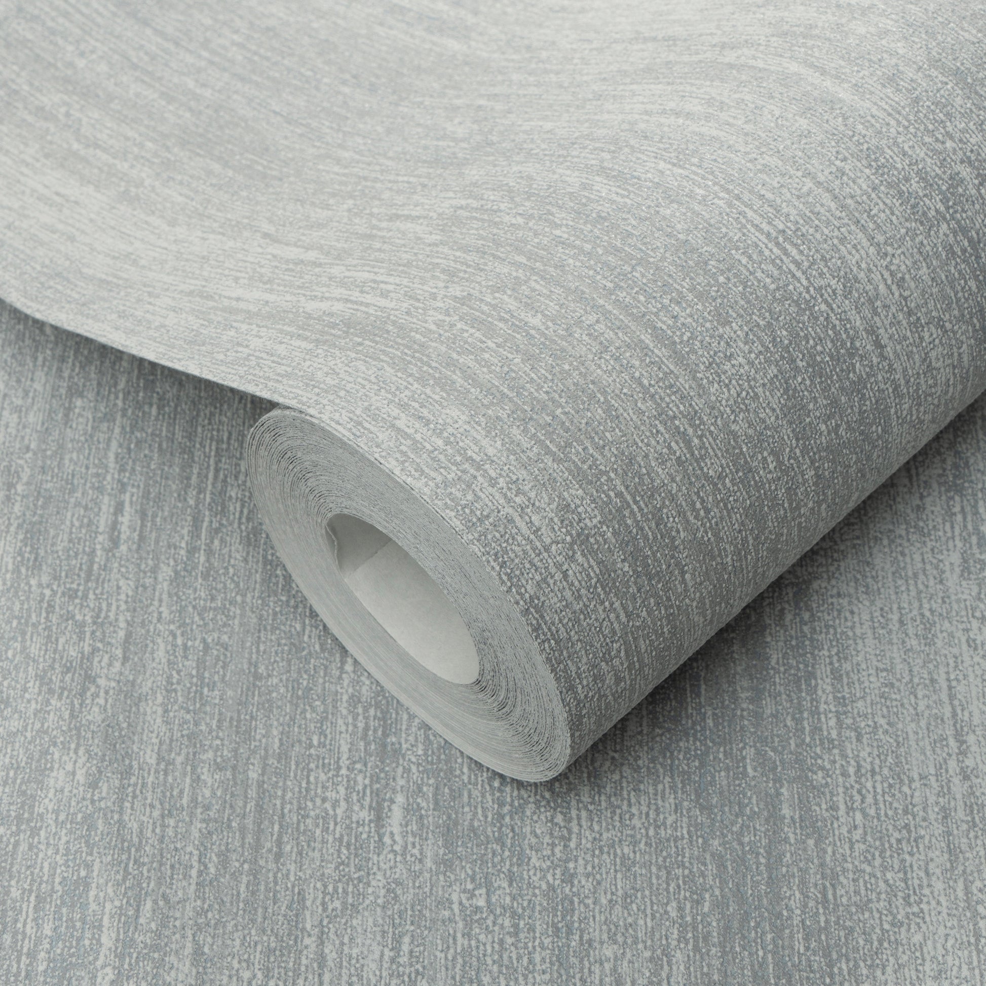 Roll of light gray textured wallpaper with subtle white streaks and brushed pattern.