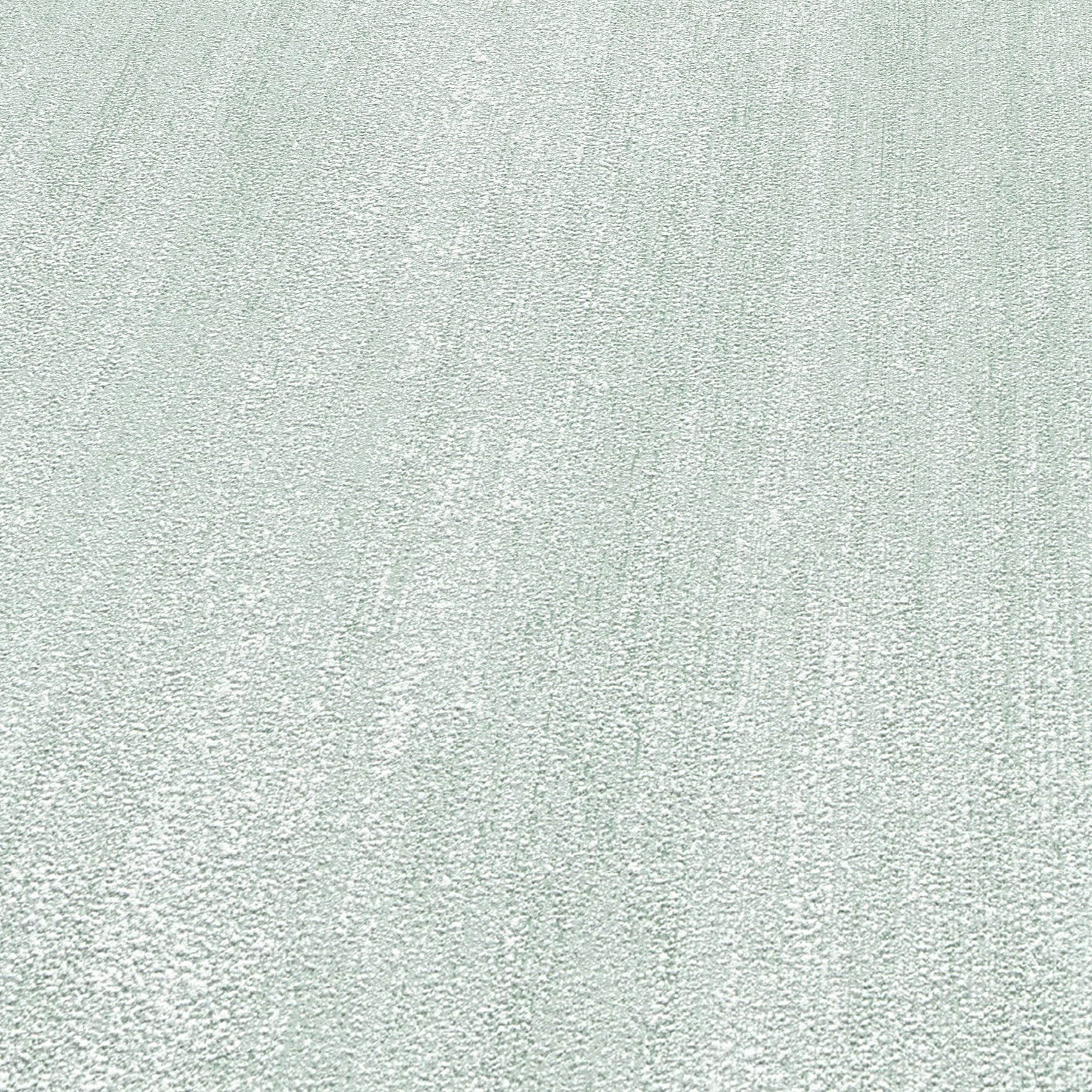Light gray textured rug close-up with soft looped pile and subtle diagonal pattern.