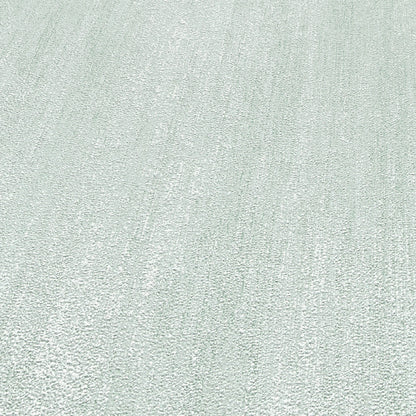 Light gray textured rug close-up with soft looped pile and subtle diagonal pattern.