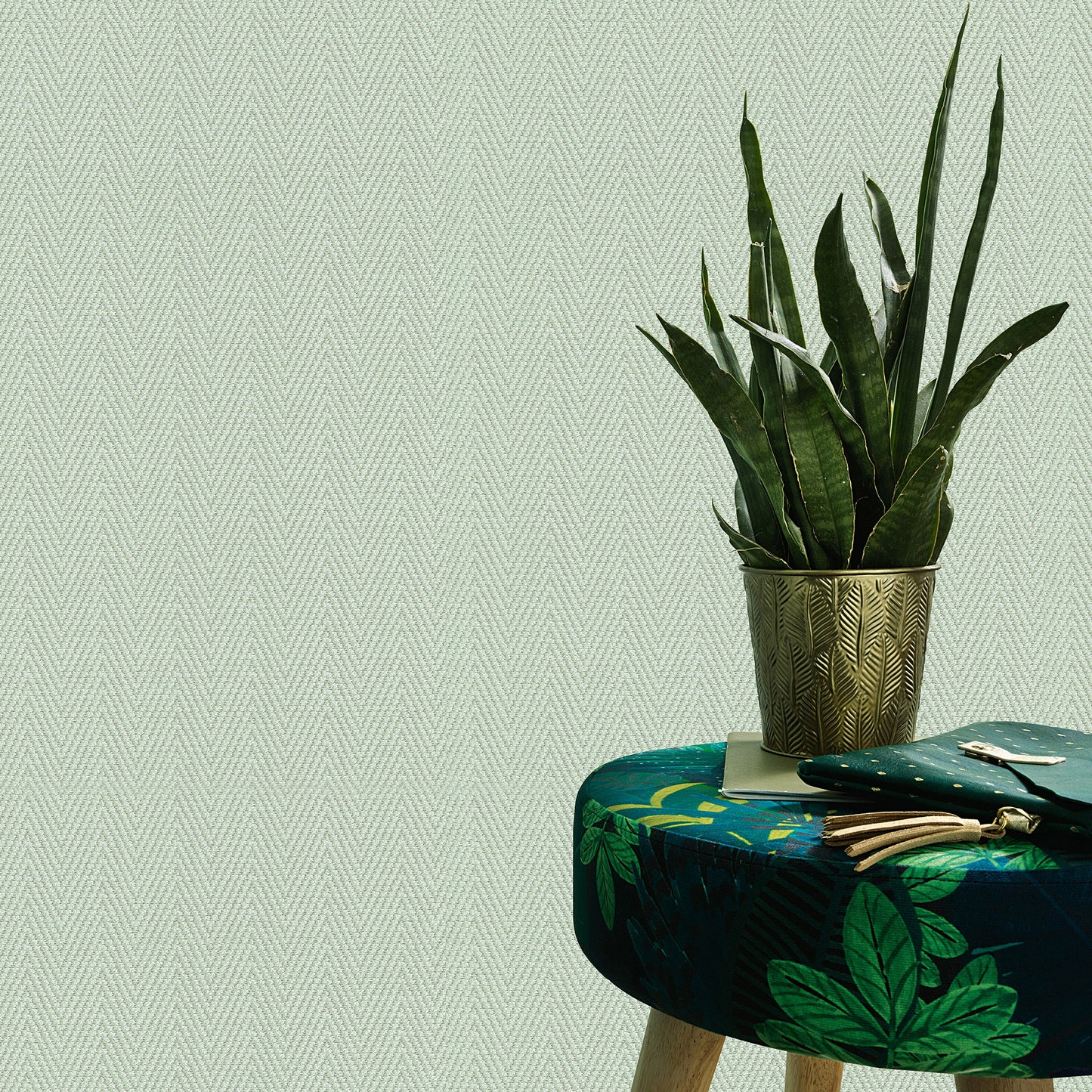 Green chevron stripe wallpaper pattern on a wall.