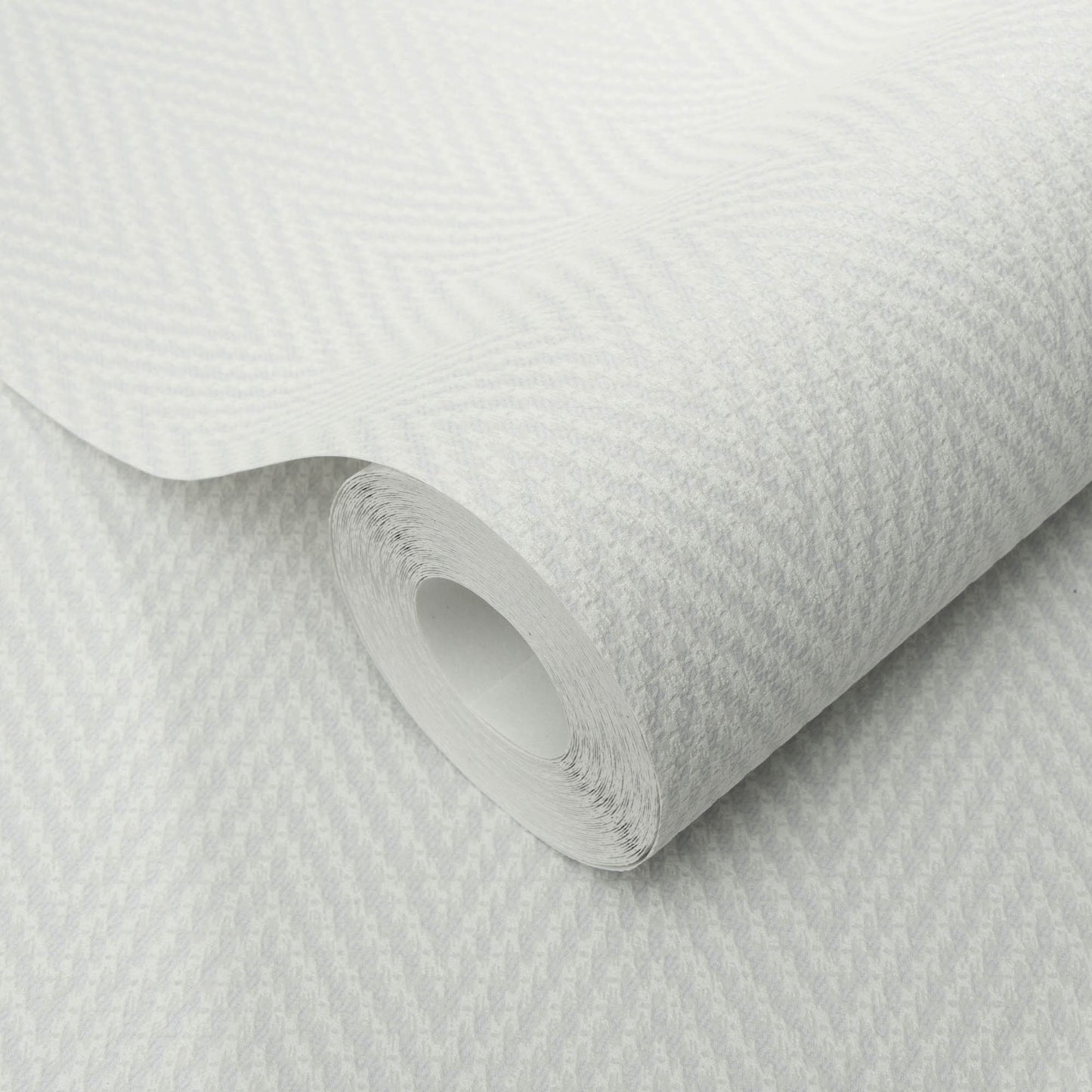 Gray chevron stripe textured wallpaper, rolled with the inner tube visible.