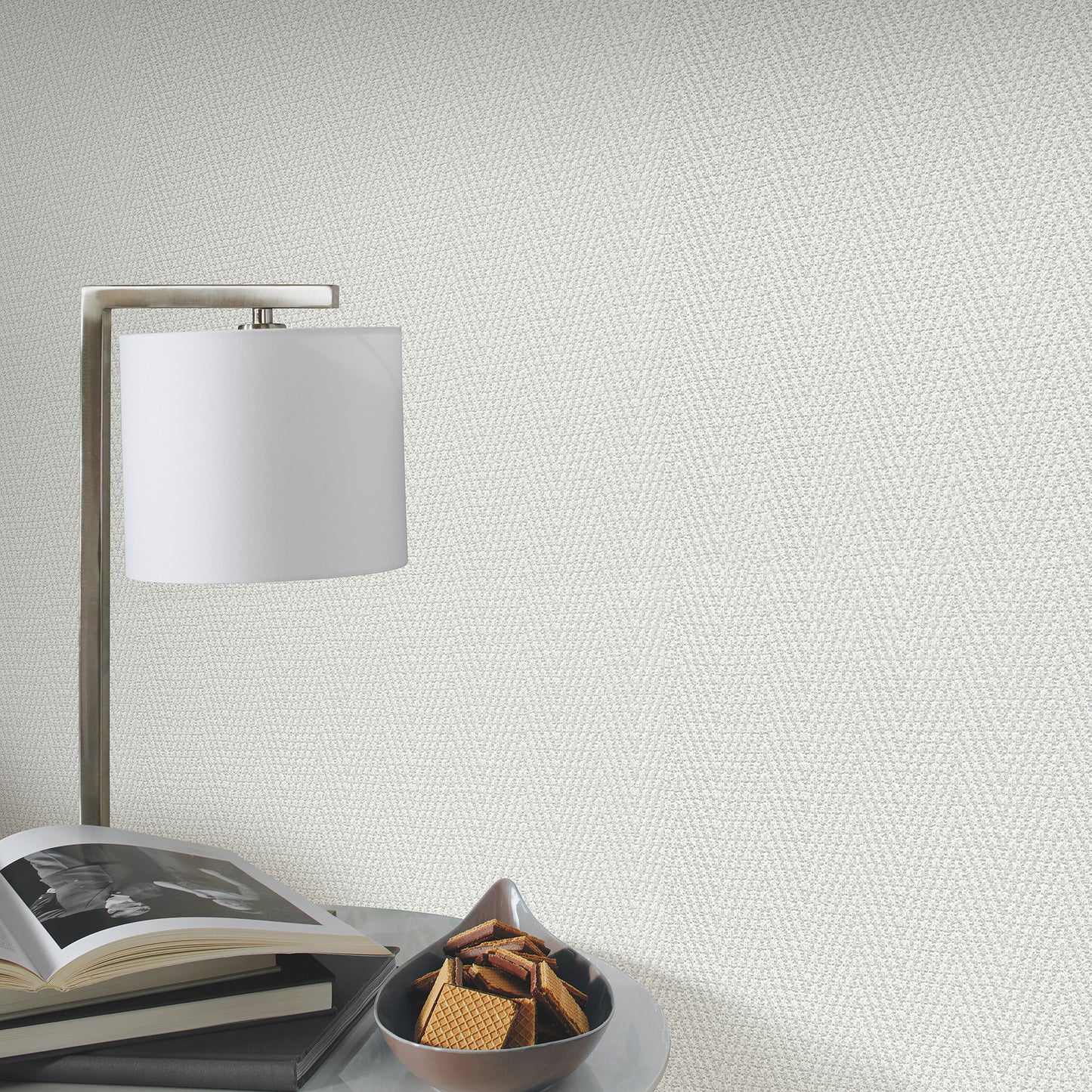 Gray chevron-striped wallpaper pattern with a traditional design.