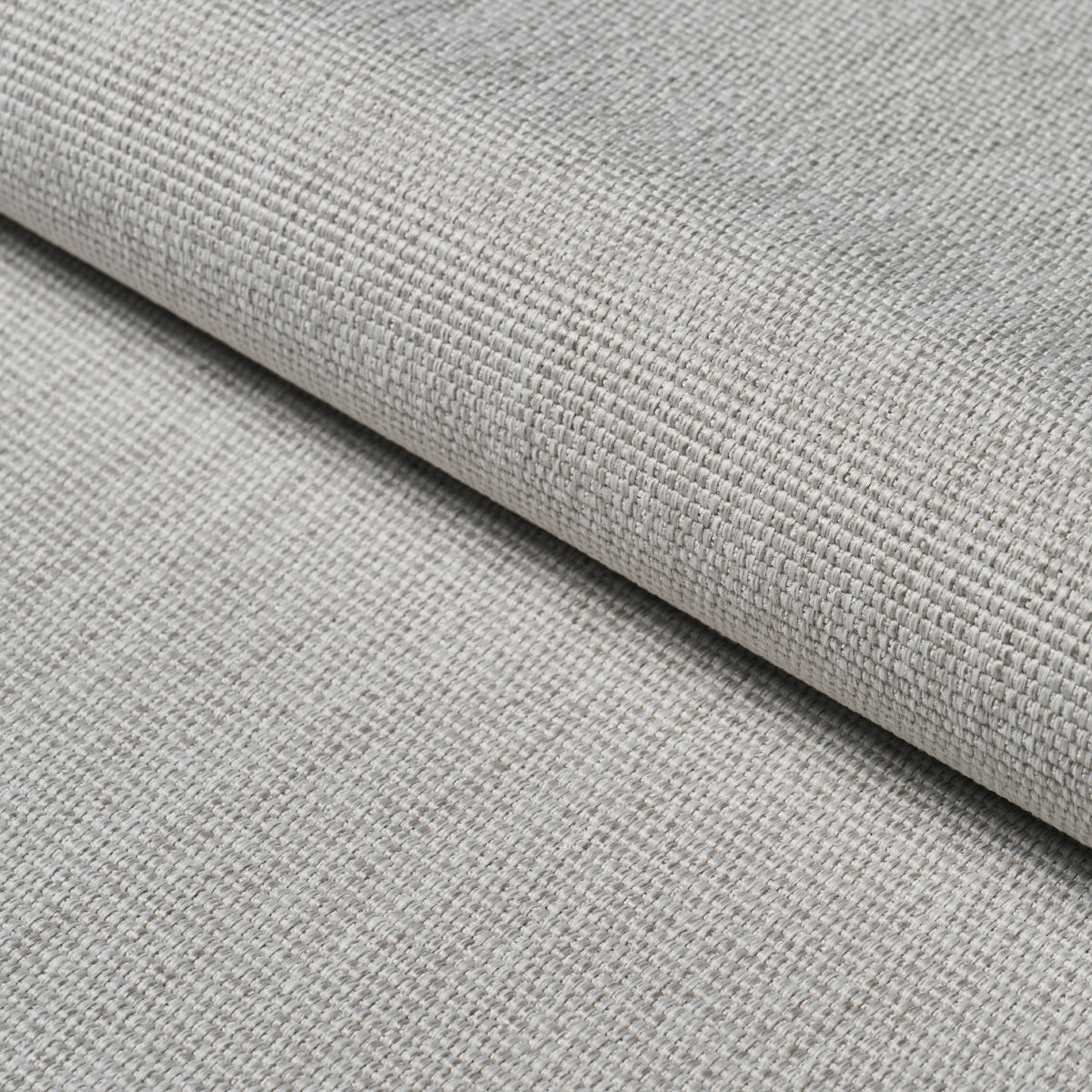 Light gray woven upholstery fabric with a tight, textured weave and folded edge.