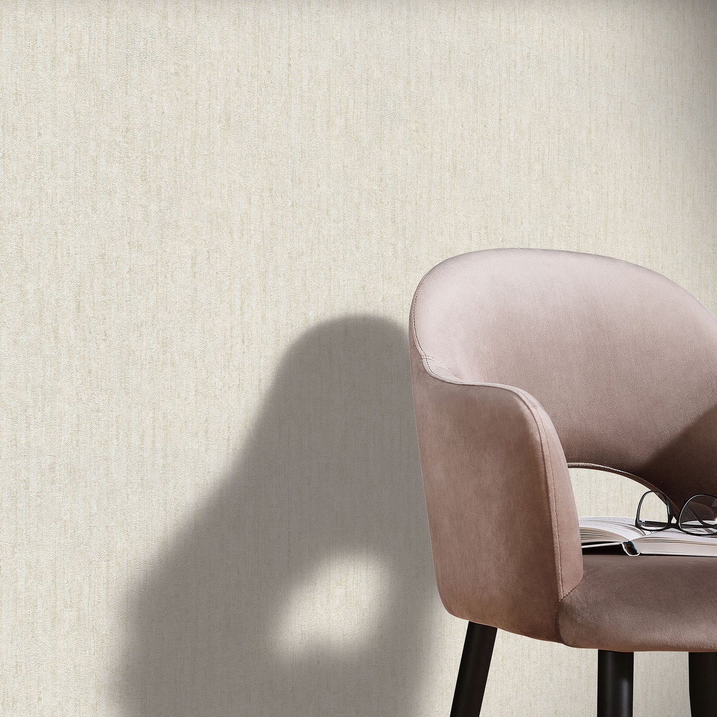 Beige textured wallpaper with an artisan pattern on a wall.