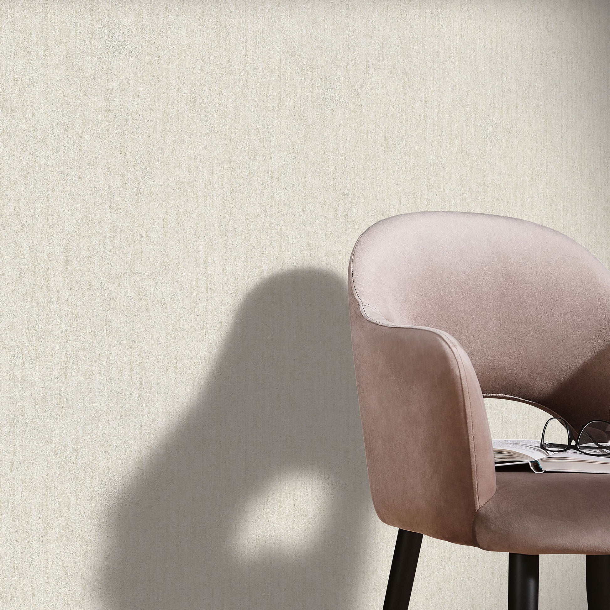 Beige textured wallpaper with an artisan pattern on a wall.