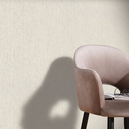 Beige textured wallpaper with an artisan pattern on a wall.