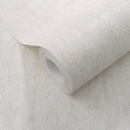 Rolled light beige textured wallpaper with a subtle stone-like pattern.