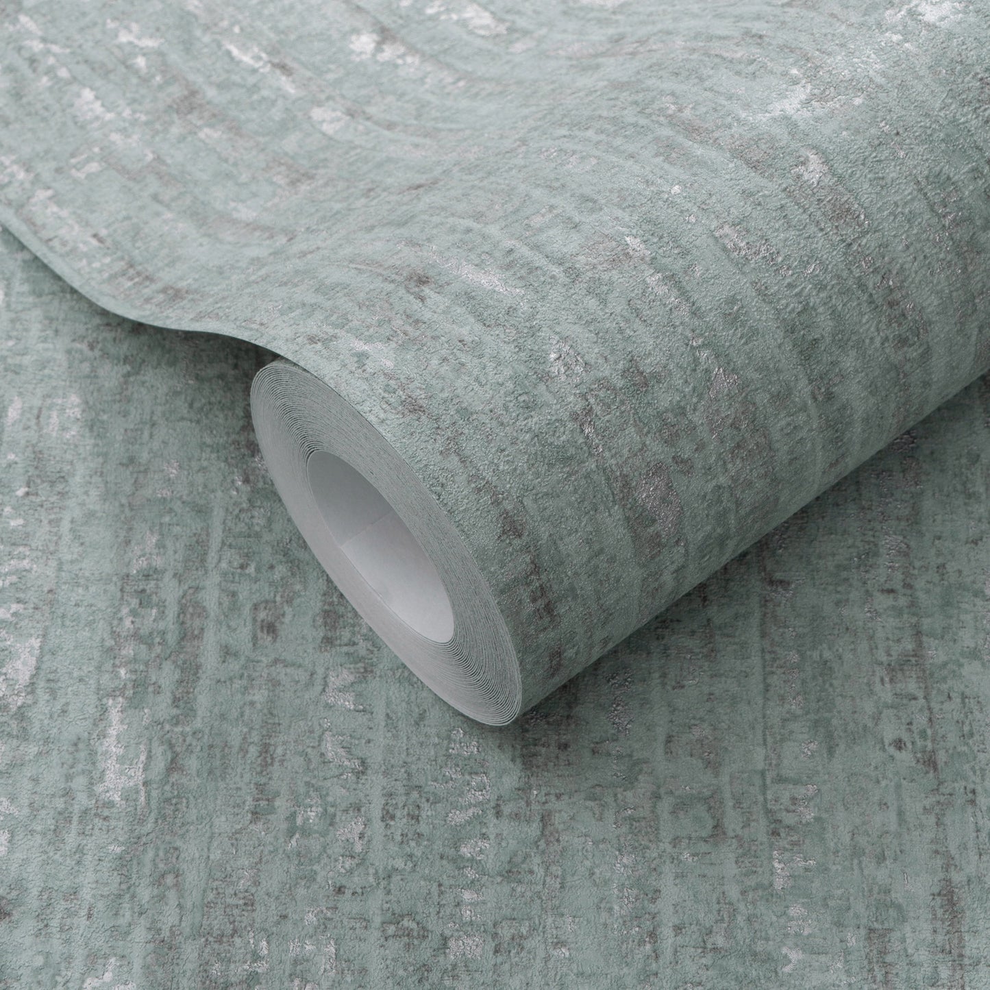 Sage green distressed wallpaper roll with subtle white marbling and fabric-like texture; core visible.