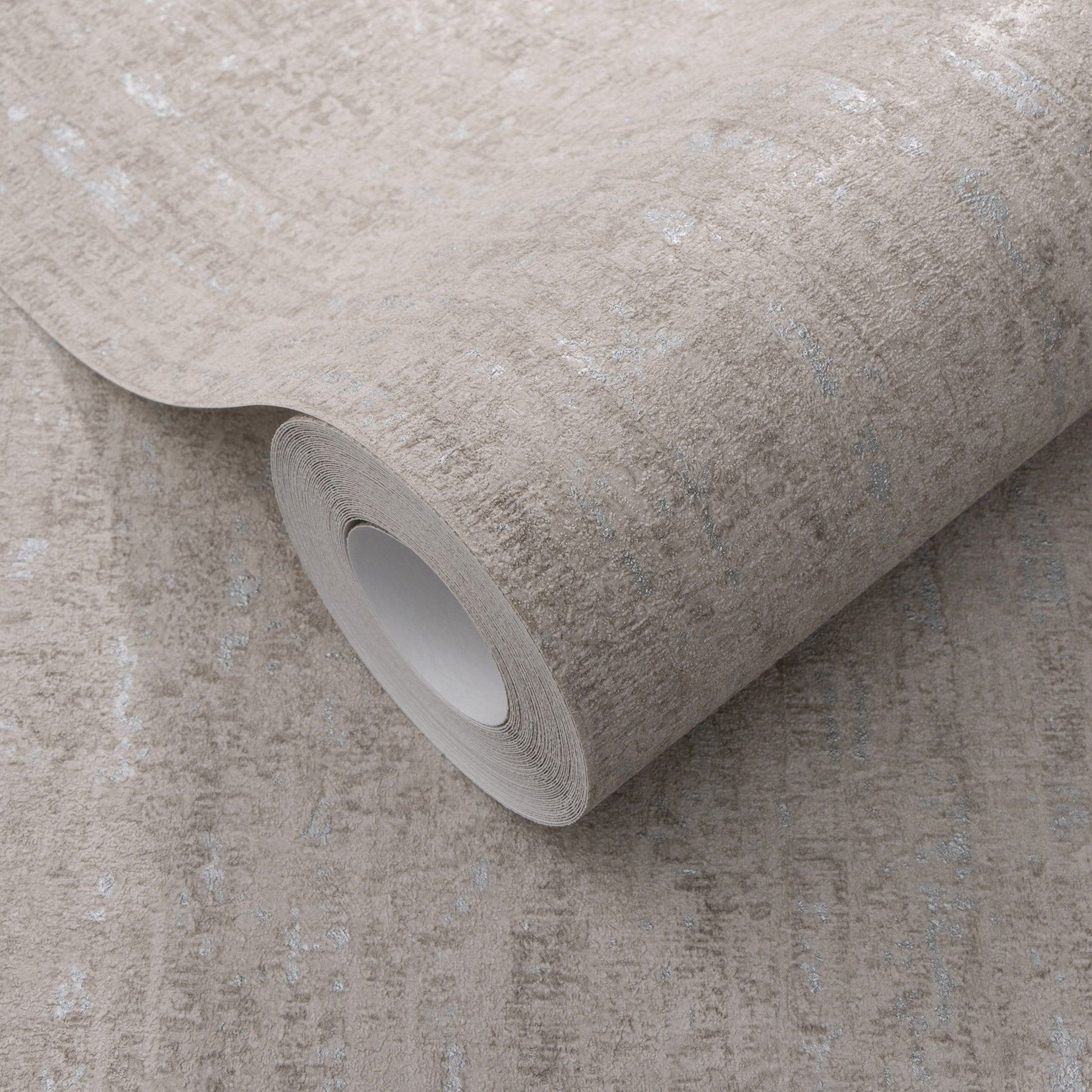 Beige textured wallpaper roll with subtle mottled stone pattern, shown partially rolled.