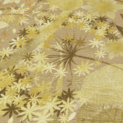 Gold-beige wallpaper featuring cream and bronze starburst flower motifs and a shimmering finish.