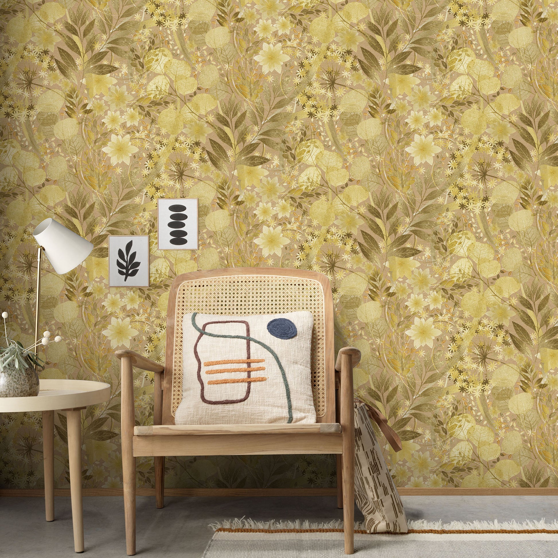 Mid-century wooden armchair with cane back, abstract-pattern cushion, beside a white side table and lamp against yellow floral wallpaper.
