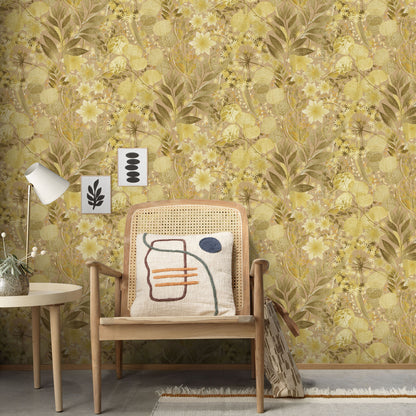 Mid-century wooden armchair with cane back, abstract-pattern cushion, beside a white side table and lamp against yellow floral wallpaper.