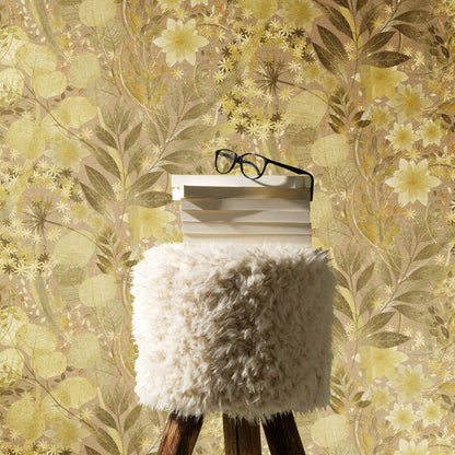 Fluffy white fur ottoman on wooden legs with stack of white books and black glasses atop, gold floral wallpaper