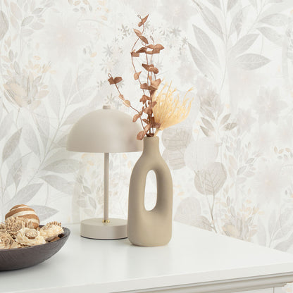 Gray floral wallpaper on a wall.
