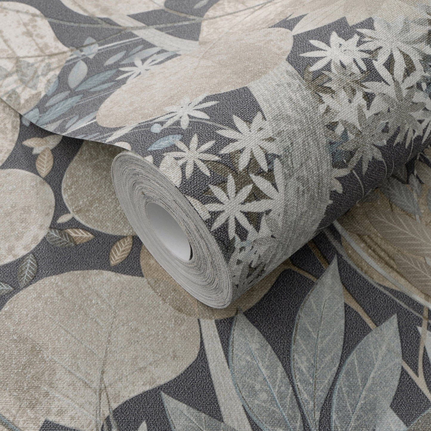 Rolled textured wallpaper with a muted navy floral/botanical print in cream, beige and blue-gray on a navy background.