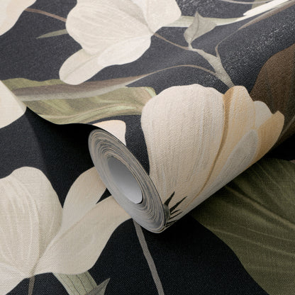 Rolled wallpaper displaying large cream flowers on a dark background; textured fabric-like wallpaper.