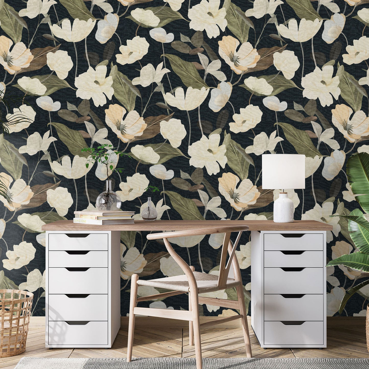 Home office with dark botanical wallpaper and cream flowers; white pedestal drawers flank a wooden desk and light wood chair.