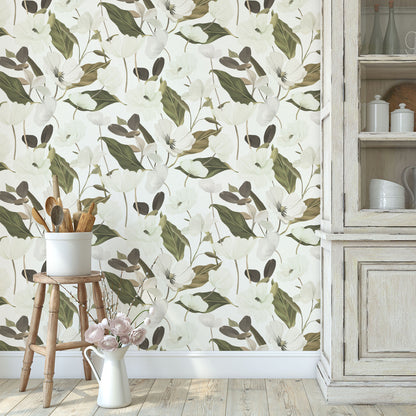 Floral wallpaper featuring white flowers and green leaves, paired with a wooden stool, white ceramic pot, and distressed wood cabinet.