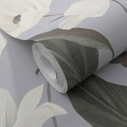 Rolled wallpaper with a soft lavender-gray background, featuring white flowers and dark green leaves.