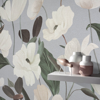 Floral wallpaper with oversized white flowers & green leaves on grey-blue; shelf with pink & white ceramic vases.