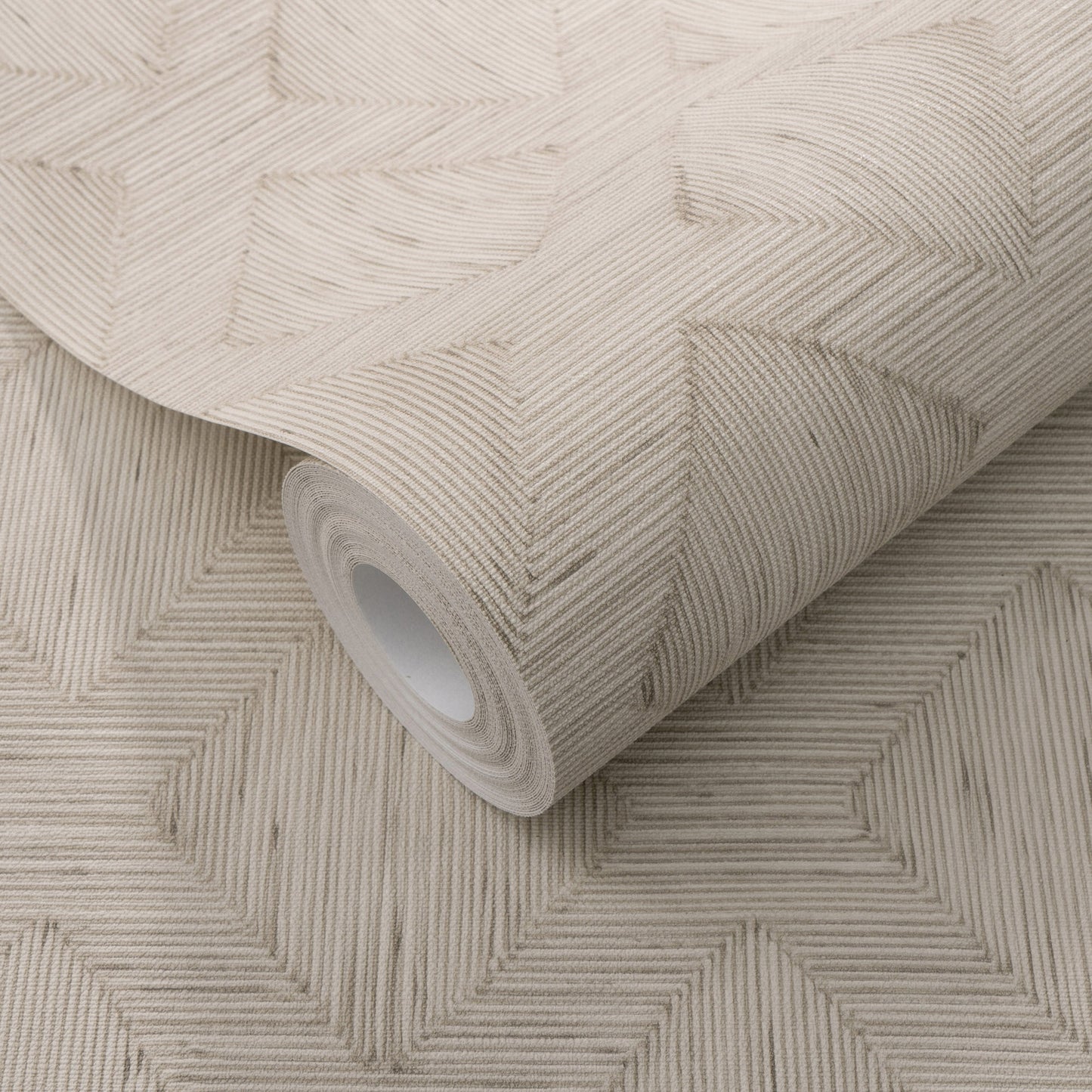 Beige textured wallpaper roll with embossed geometric interlocking squares formed by diagonal lines.
