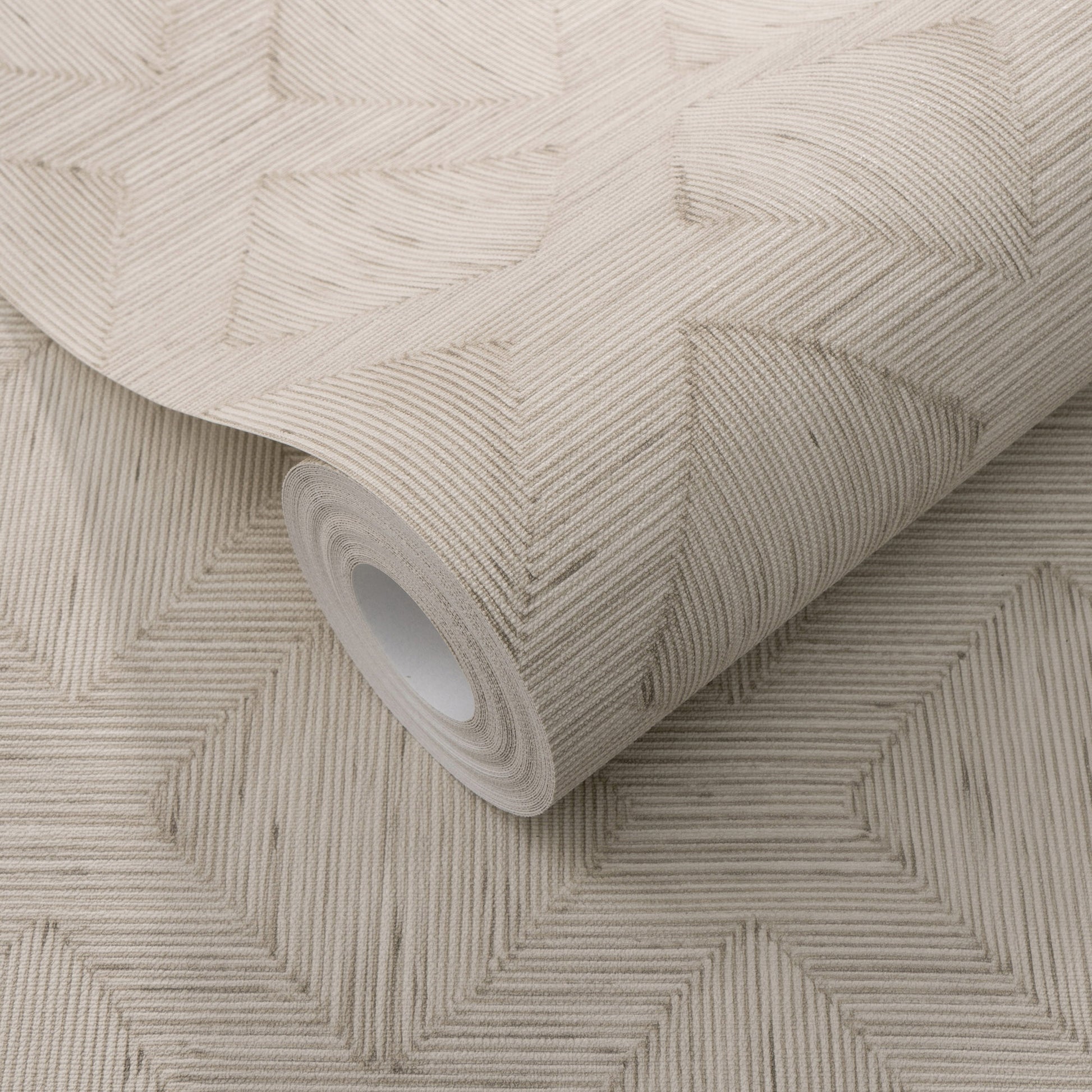 Beige textured wallpaper roll with embossed geometric interlocking squares formed by diagonal lines.