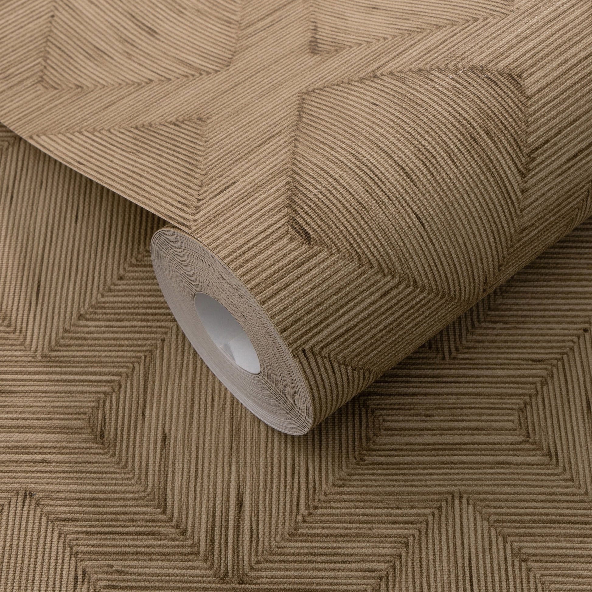 Brown textured wallpaper roll with a geometric stepped-square pattern and ribbed lines for wall decor.