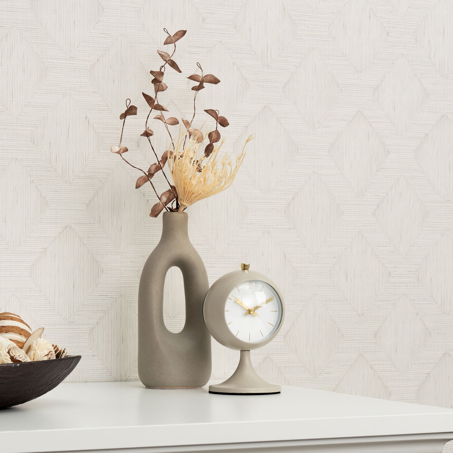 Gray wallpaper with a subtle geometric pattern; modern neutral gray decor.