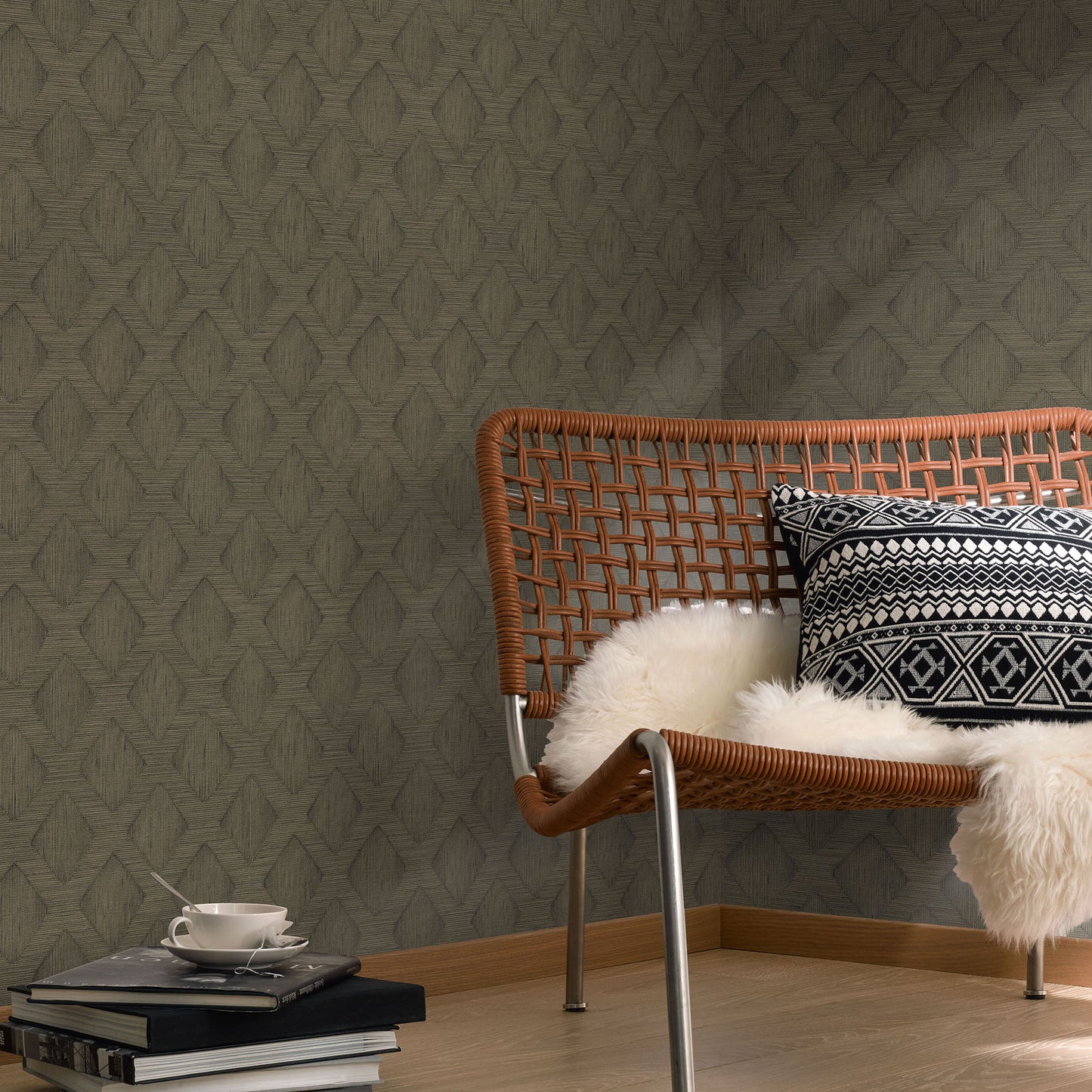 Rattan lounge chair with metal legs, black-white geometric cushion and white faux fur throw; wood floor, grey wallpaper.