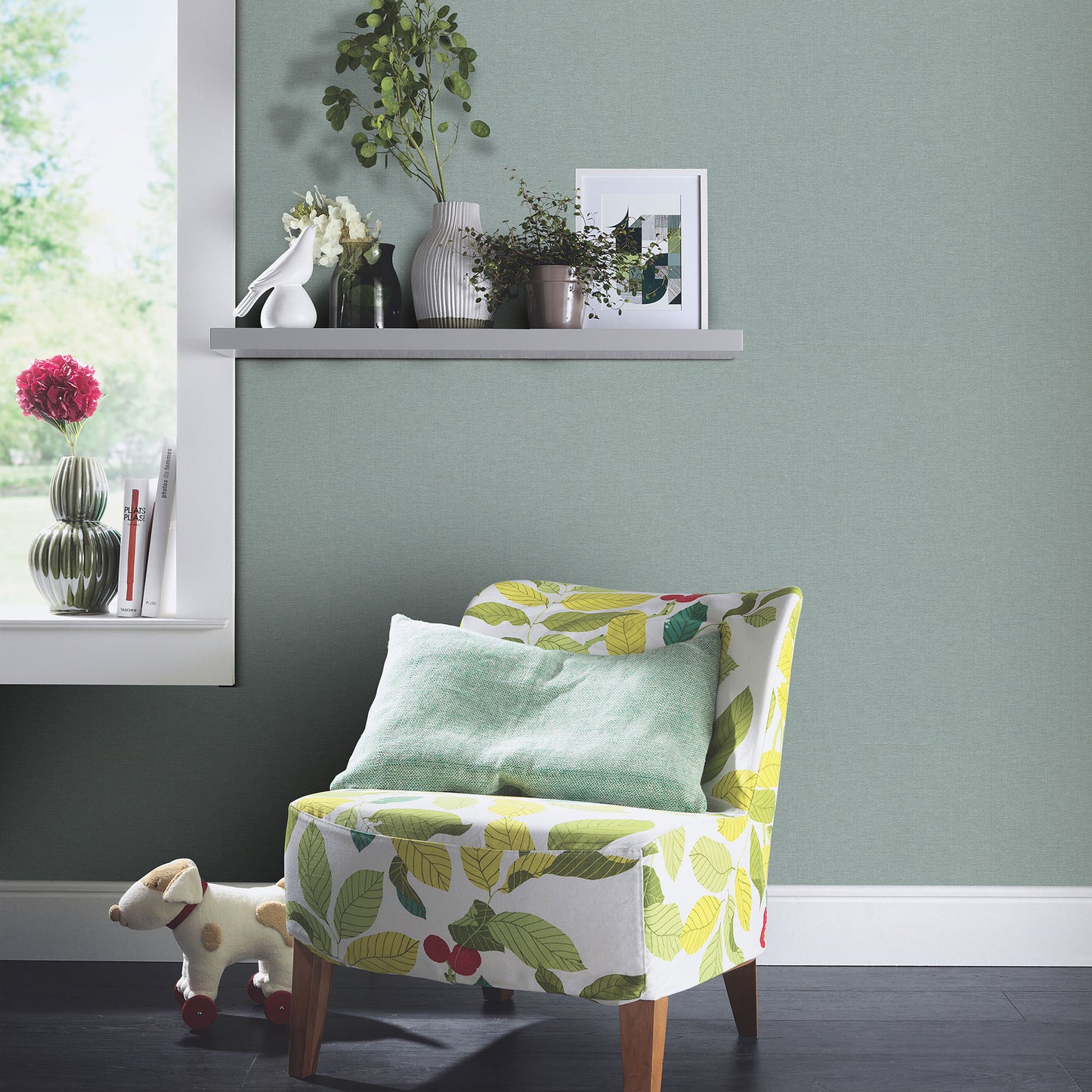 Teal wallpaper with a subtle leaf-print pattern and linen texture.