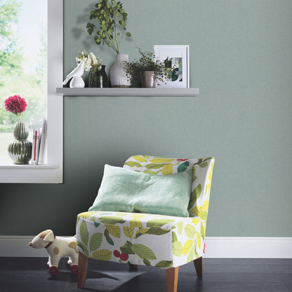 Teal wallpaper with a subtle leaf-print pattern and linen texture.