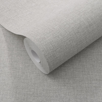 Roll of light gray textured wallpaper with a subtle linen-style weave on a cardboard core.