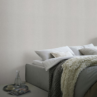 Light gray linen serenity wallpaper with a traditional pattern; subtle, textured wall surface.