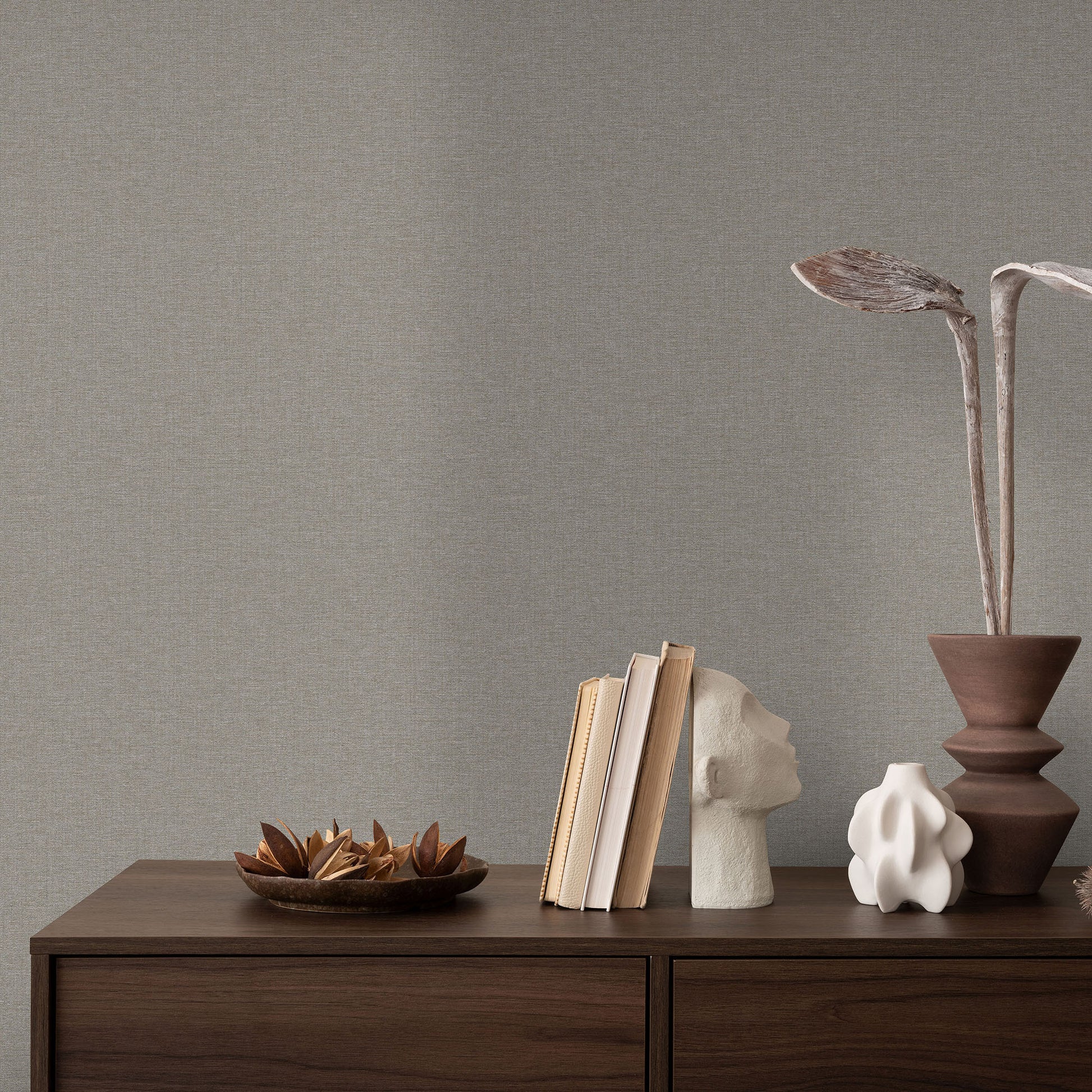 Dark gray wallpaper with a subtle linen texture and traditional pattern.