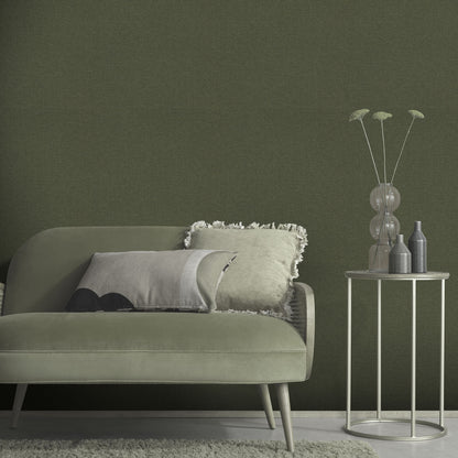 Sage-green wallpaper with a linen texture in a traditional green pattern.