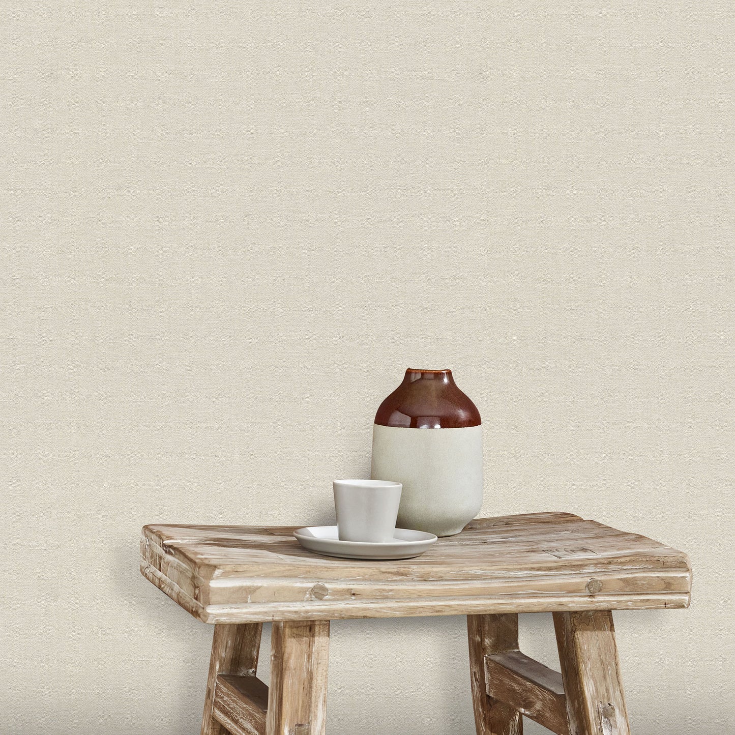 Off-white wallpaper with a subtle linen texture and traditional pattern.