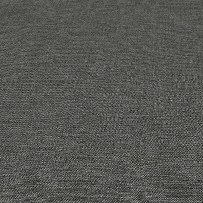 Dark gray linen-textured wallpaper close-up with subtle weave.