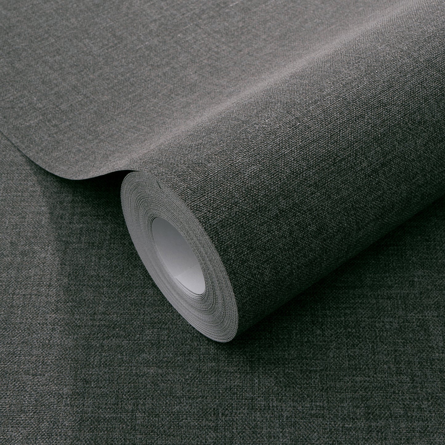 Dark grey textured wallpaper with a linen-like weave pattern.