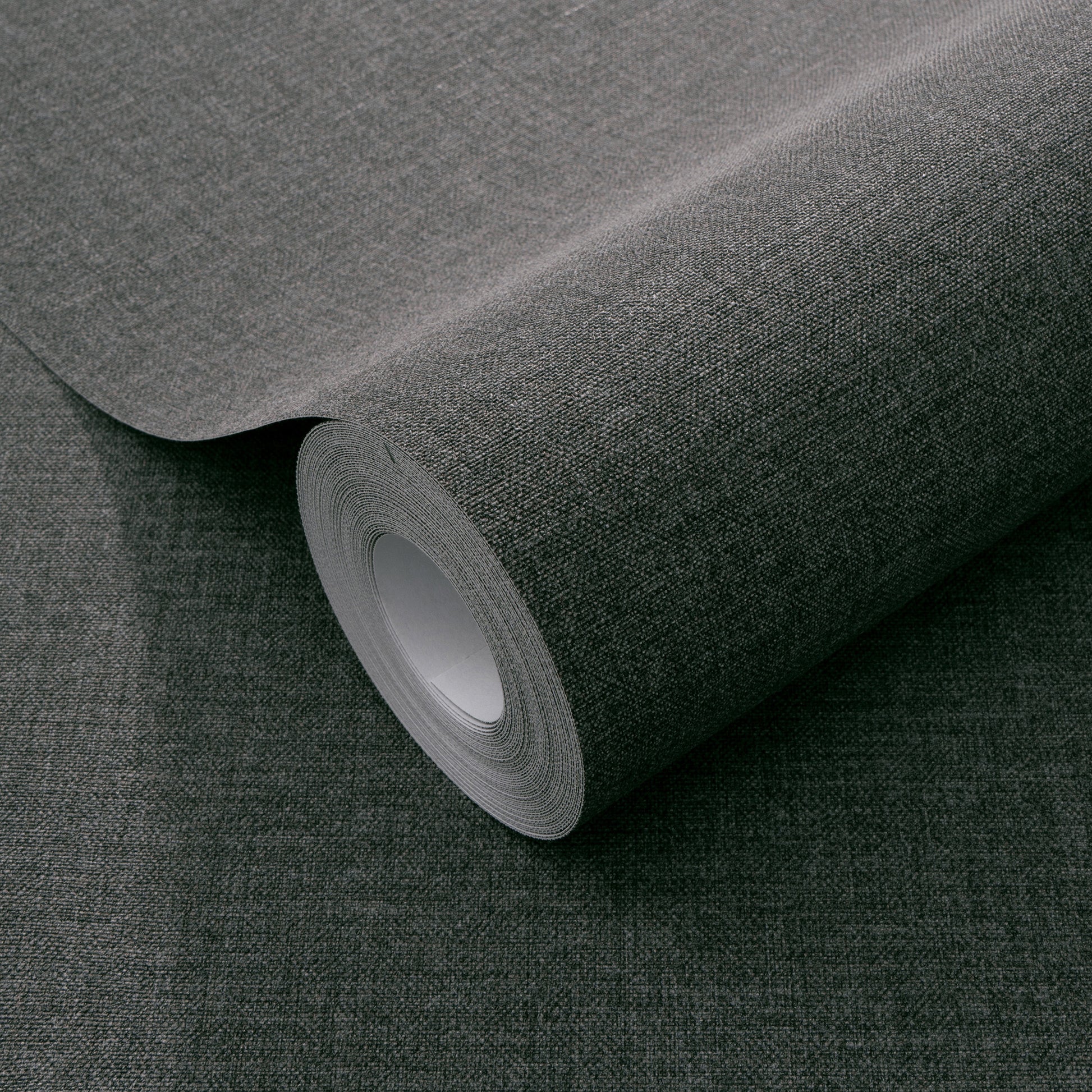 Dark grey textured wallpaper with a linen-like weave pattern.