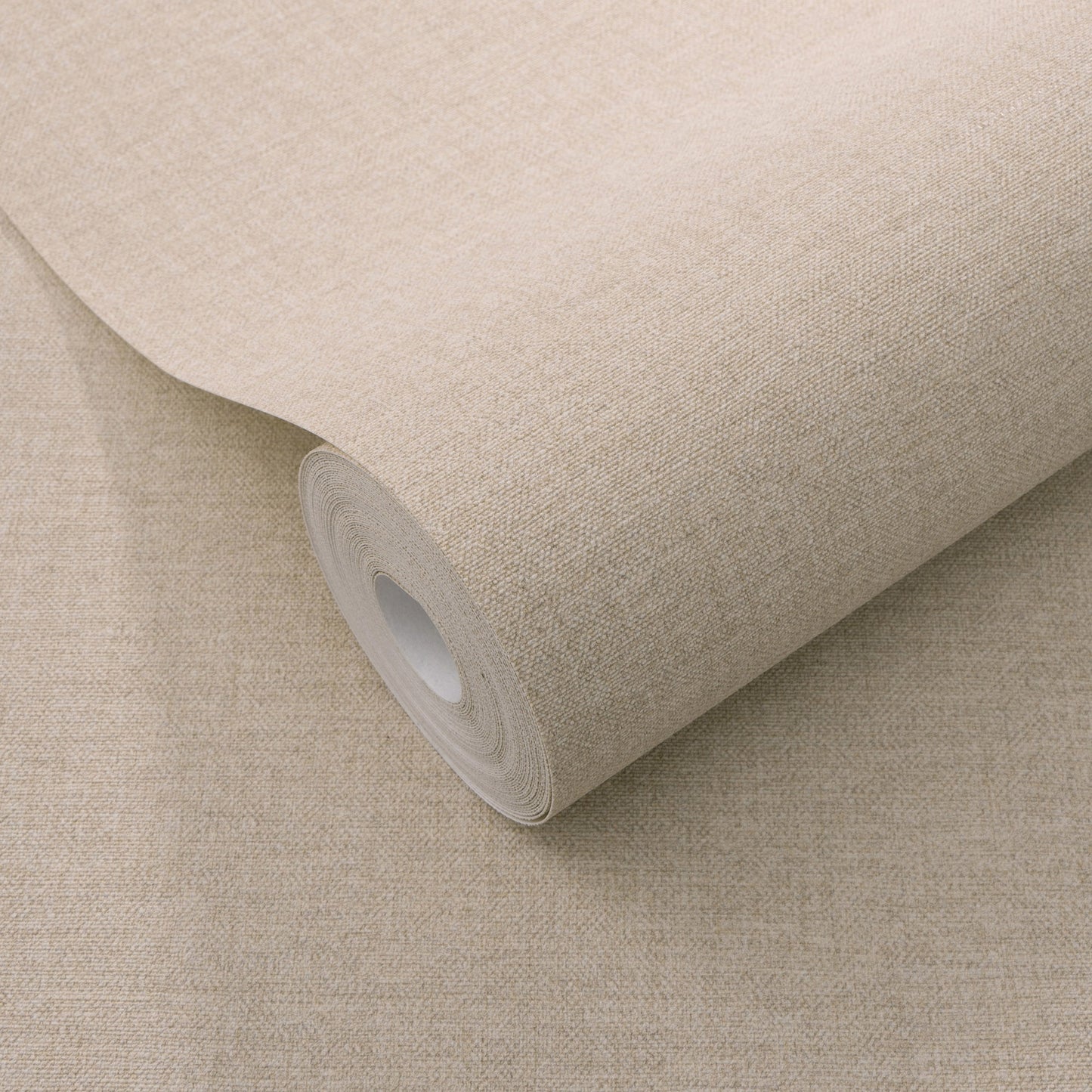 Pink linen-textured wallpaper roll with white core and woven fabric look.