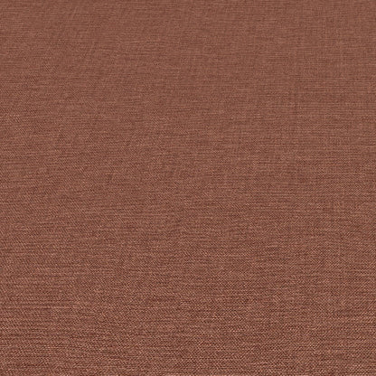 Close-up of red linen-textured wallpaper with a tight woven pattern.