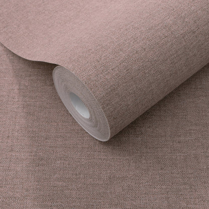 Dusty rose textured wallpaper roll with white core; traditional purple wallpaper pattern.