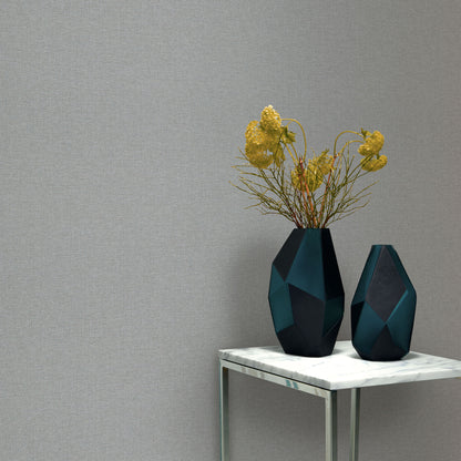 Traditional gray wallpaper pattern with a linen-like texture and subtle tonal variation.