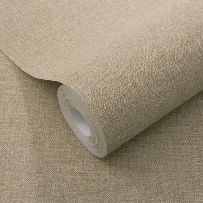 Beige linen-textured wallpaper roll with cardboard core on a matching tan surface.