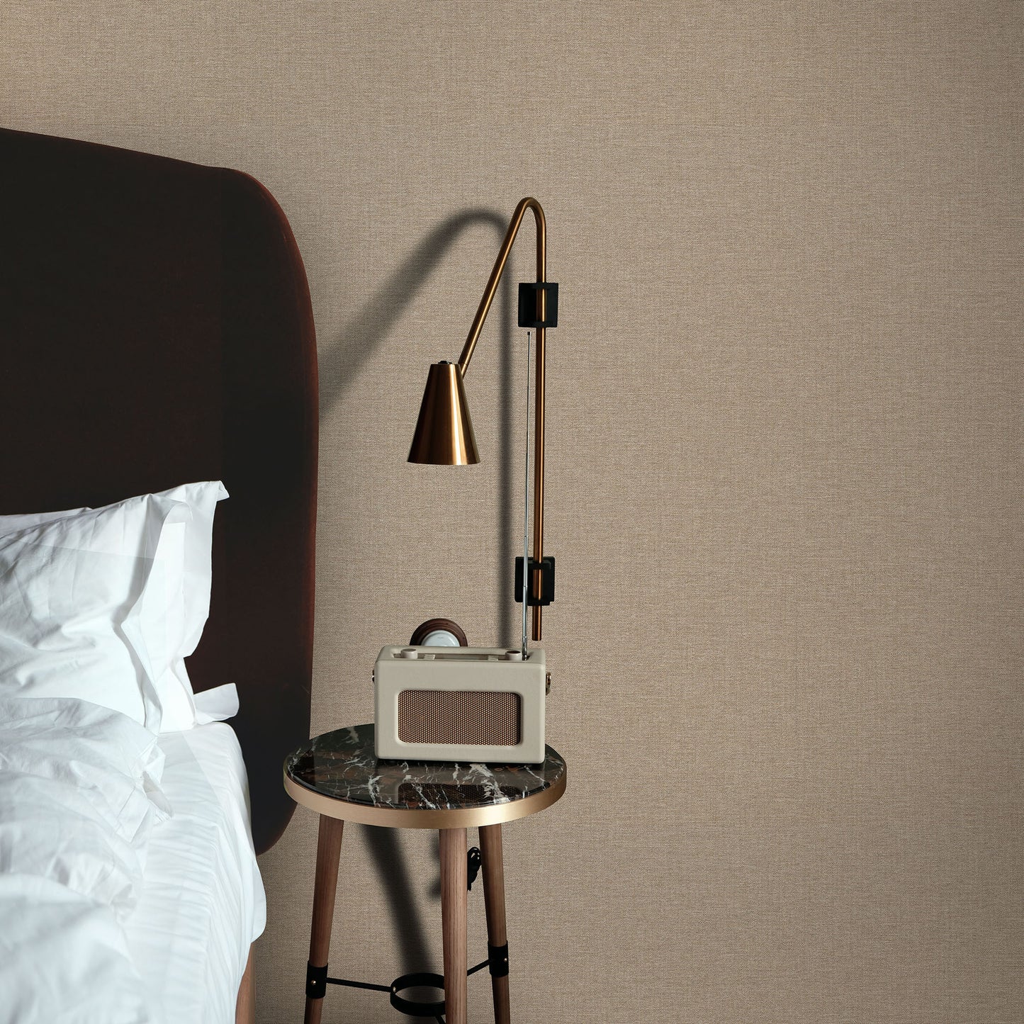 Beige textured wallpaper in linen serenity brown with a traditional pattern on the wall.