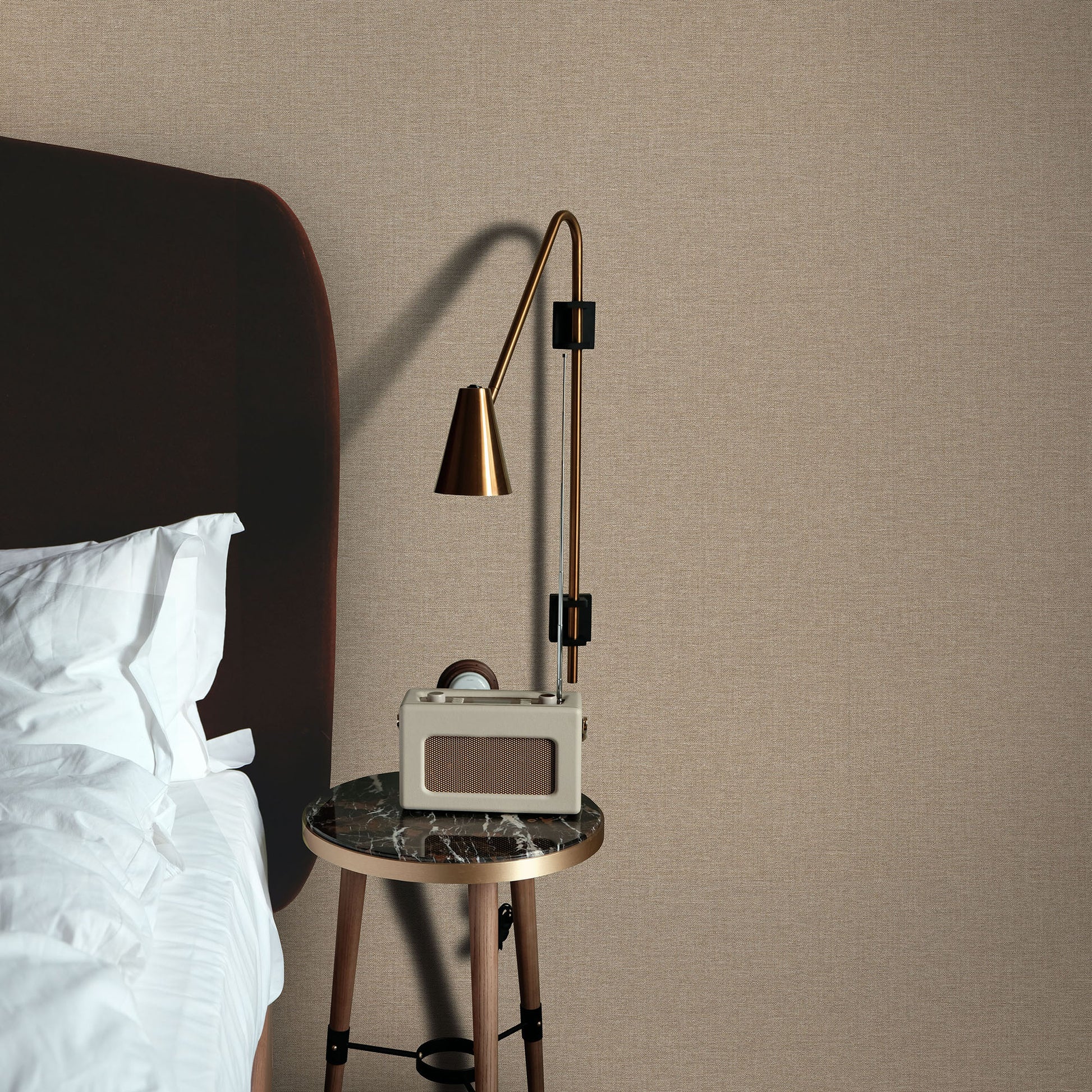 Beige textured wallpaper in linen serenity brown with a traditional pattern on the wall.