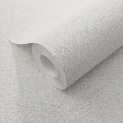 Cream linen-textured wallpaper roll with a cardboard core, partially unrolled.